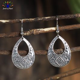 Silver Toned Self Patterned Drop Shaped Earrings - Jewels of Nepal